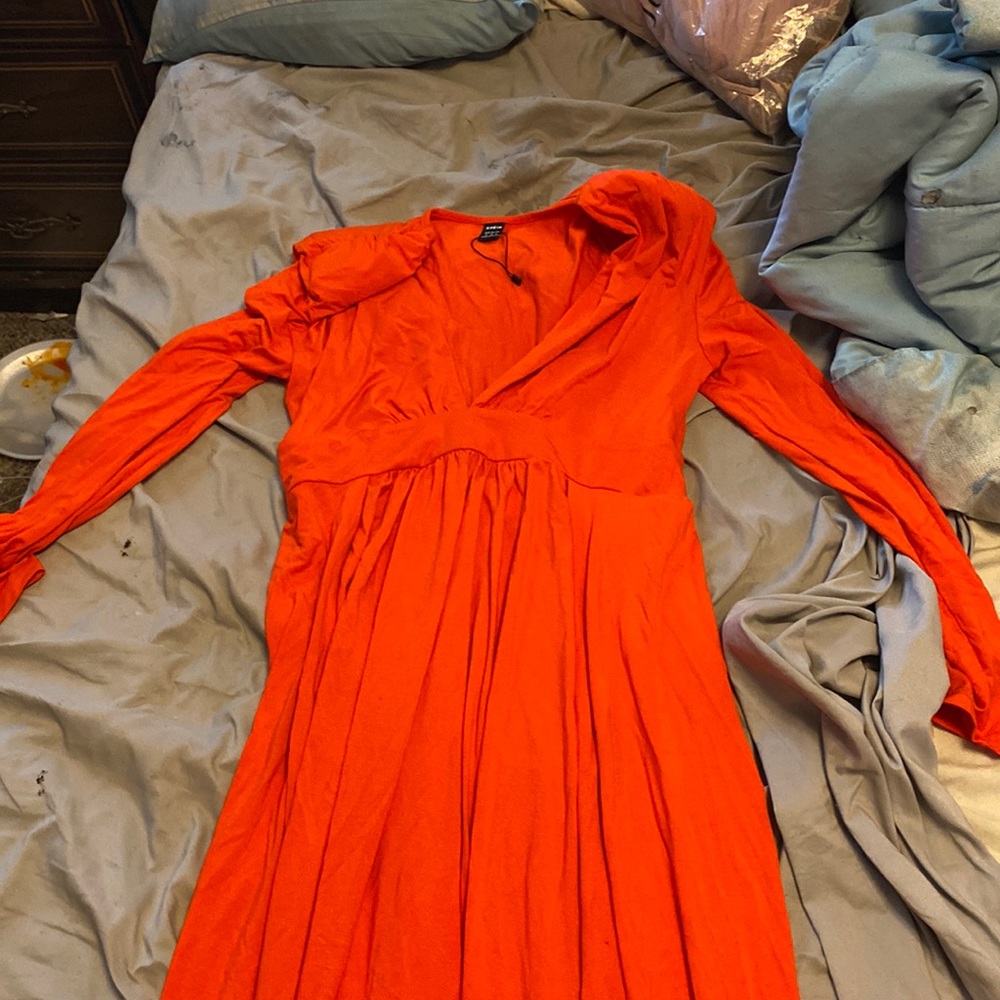This dress is a very low cut dress but long the bottom is thigh high split